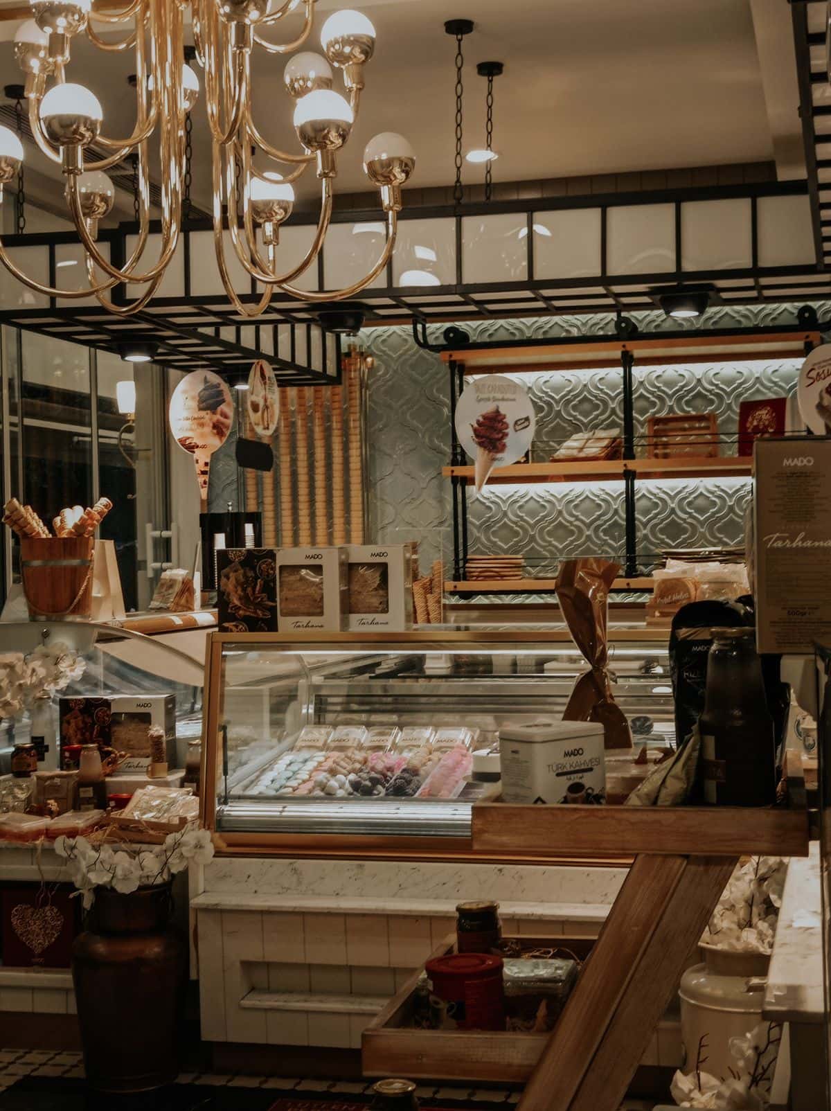 Warm bakery shop interior with a pastry counter
