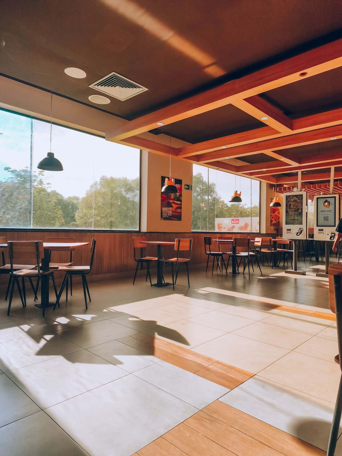 Warmly lit restaurant dining room in natural light
