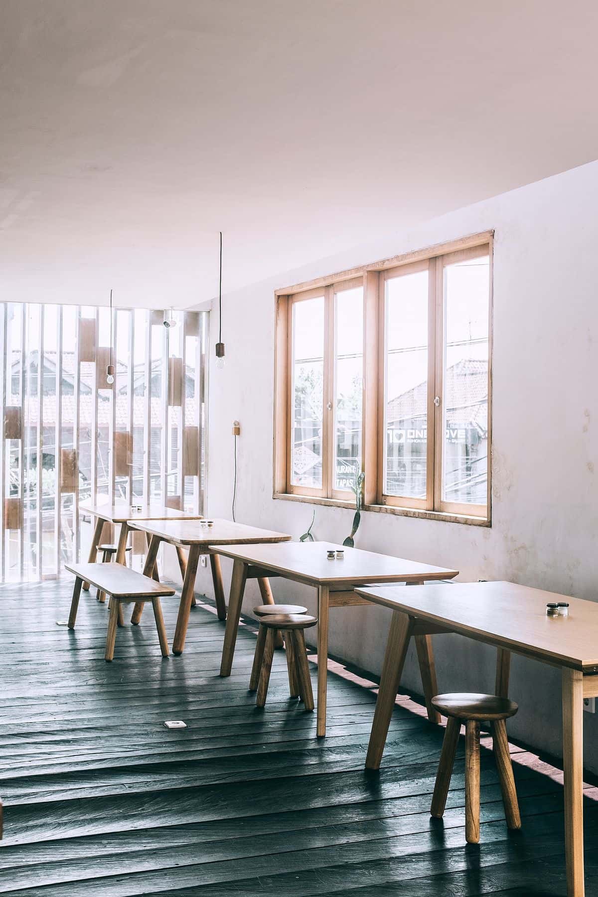 Cozy cafe with wooden tables near a window
