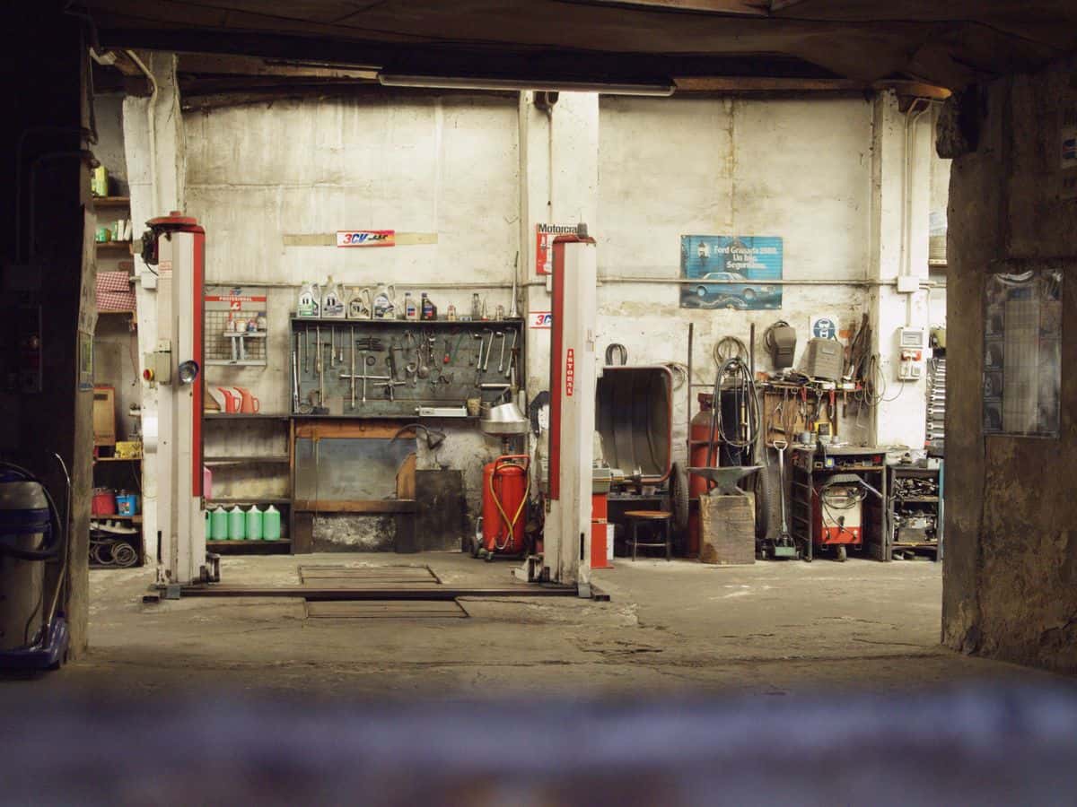 Car workshop with tools, machinery, and lifts